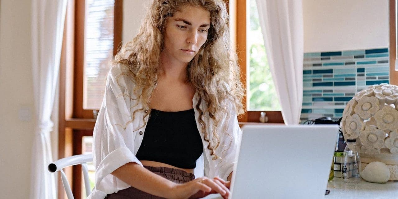 a woman infront of her laptop probably working